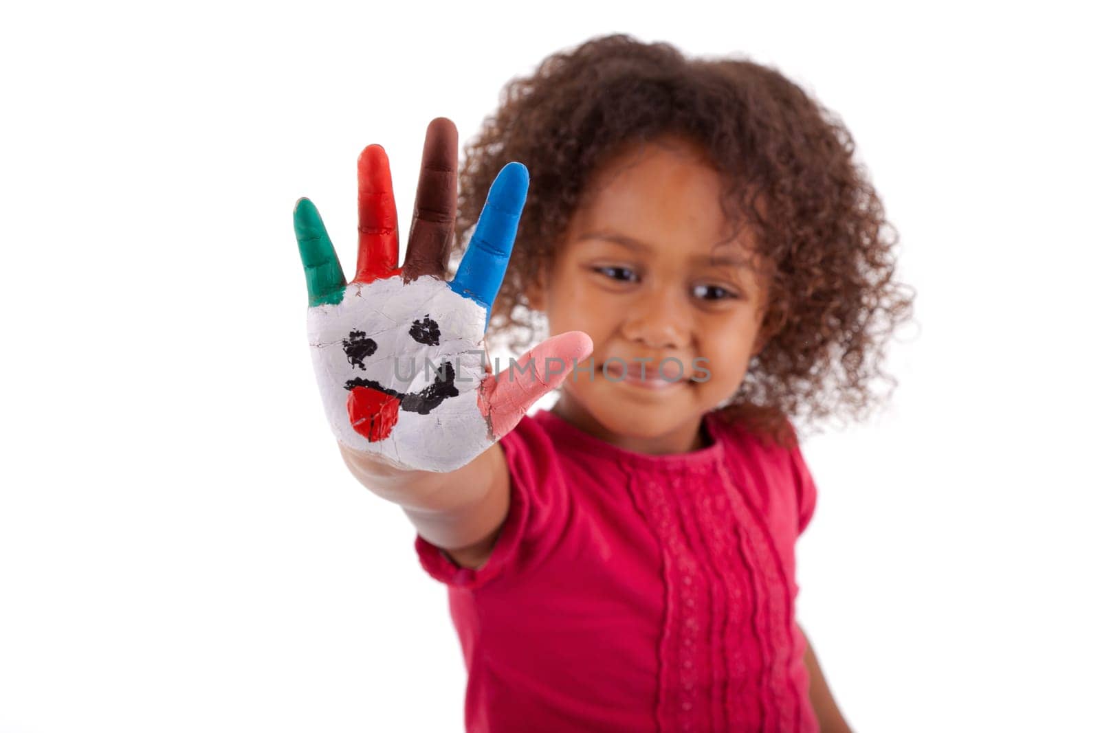 Little African Asian girl with painted hands in colorful paints