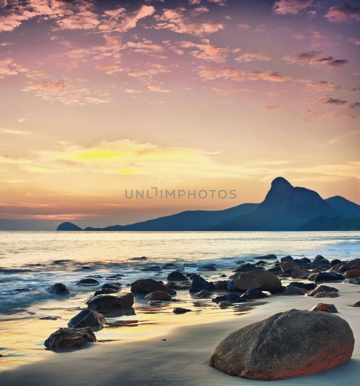 Sunrise over the sea. Stone on the foreground