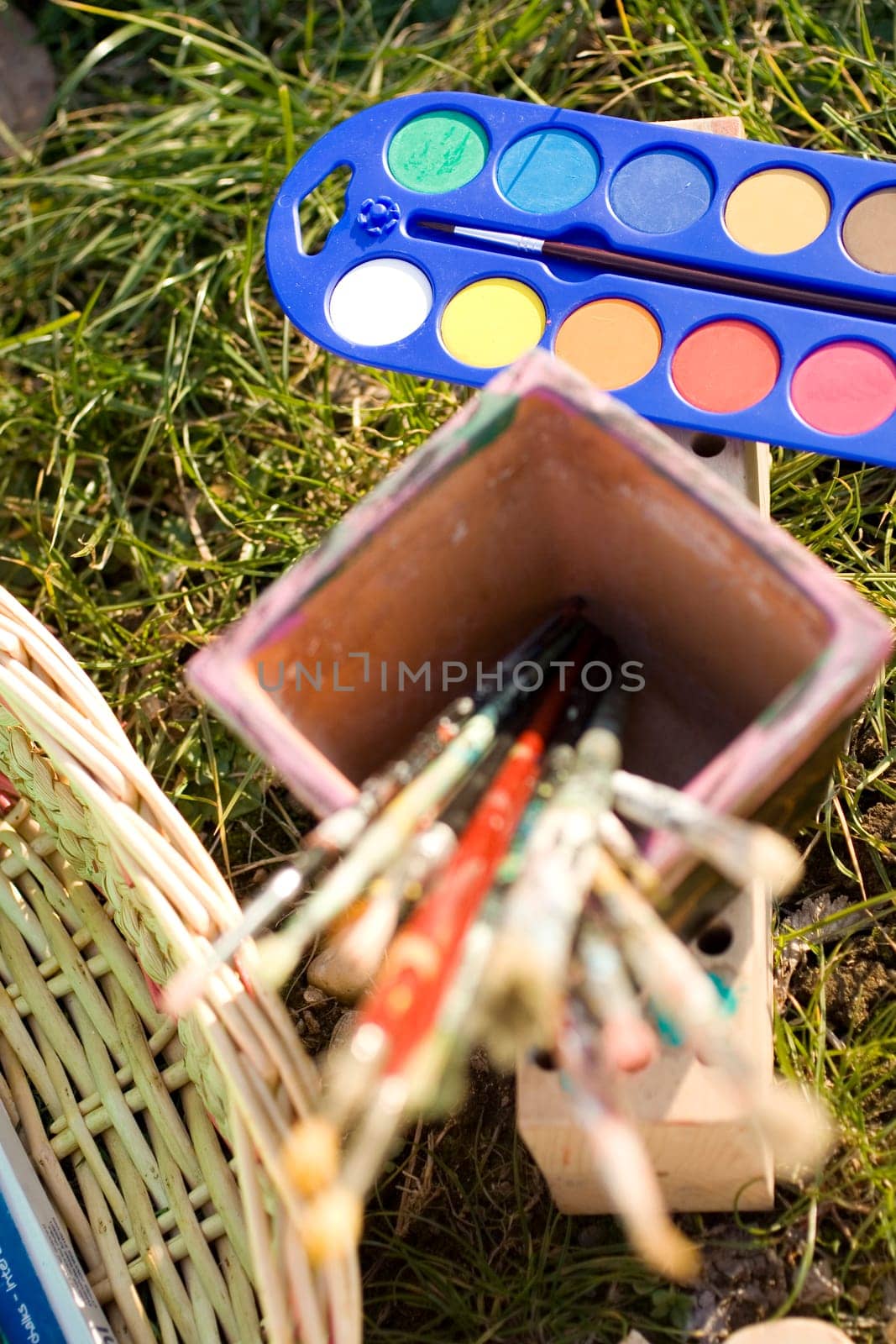 Paintbrushes on colorful background