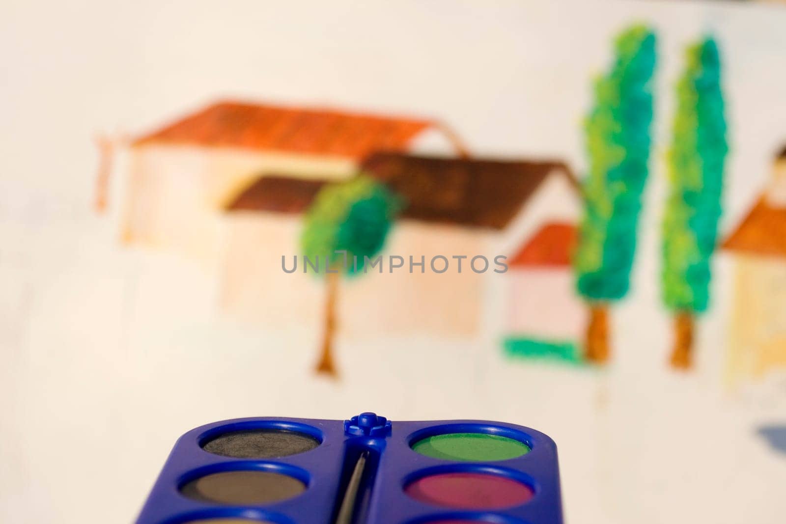 Photo of watercolors on painted canvas