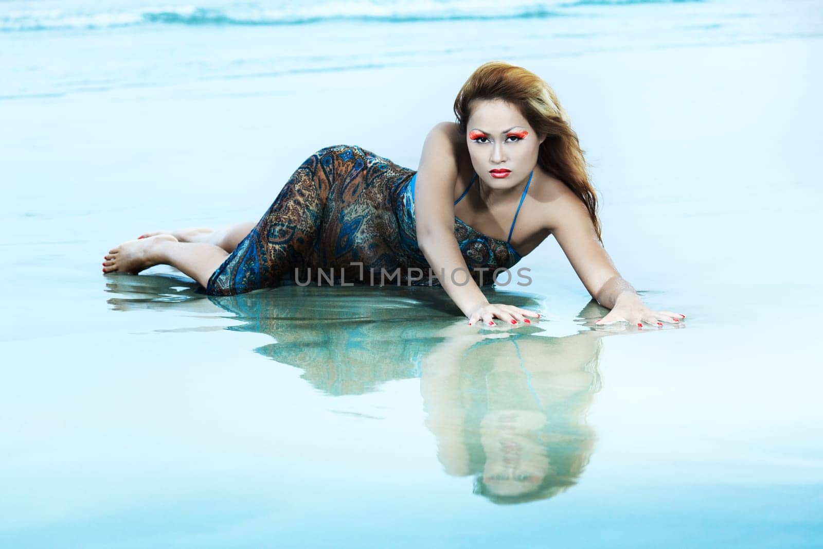 Beautiful asian model posing on the beach