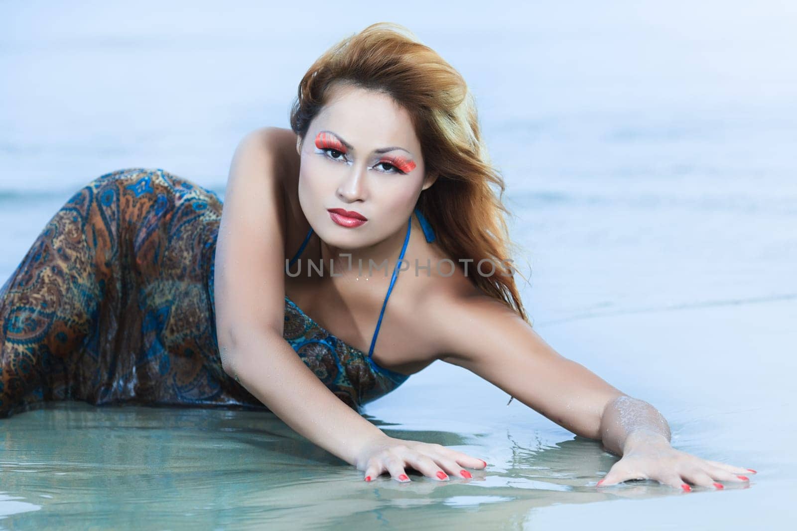 Beautiful asian model posing on the beach