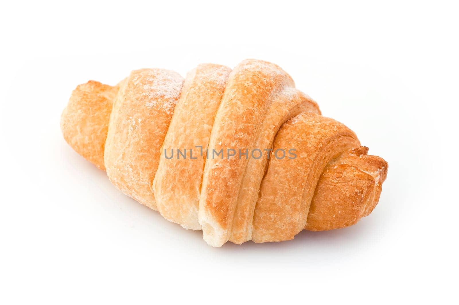 Single fresh croissant, casting soft whadow on white.
