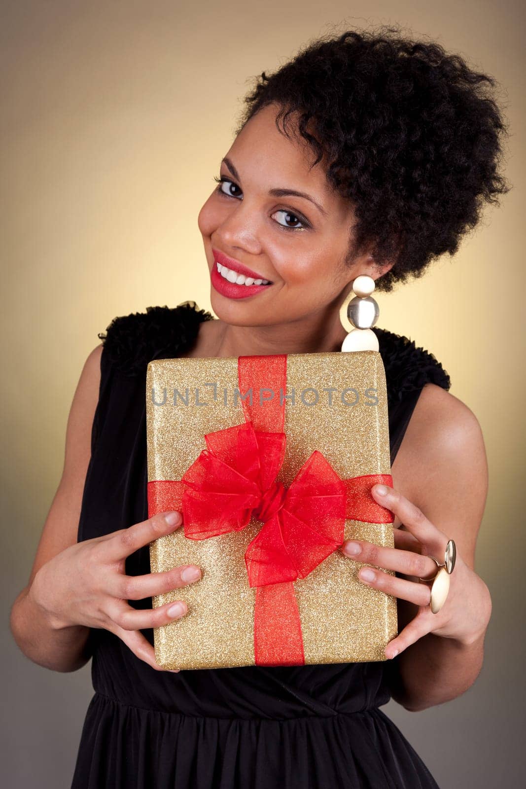 Young African American woman holding a gift box