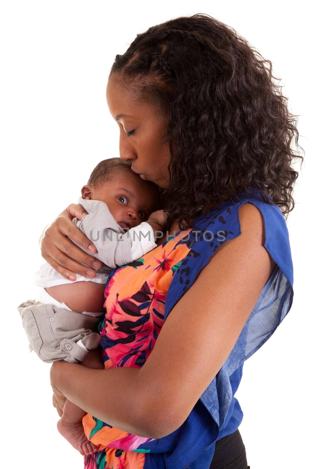 Young African American mother holding and kissing her baby boy, isolated on white background