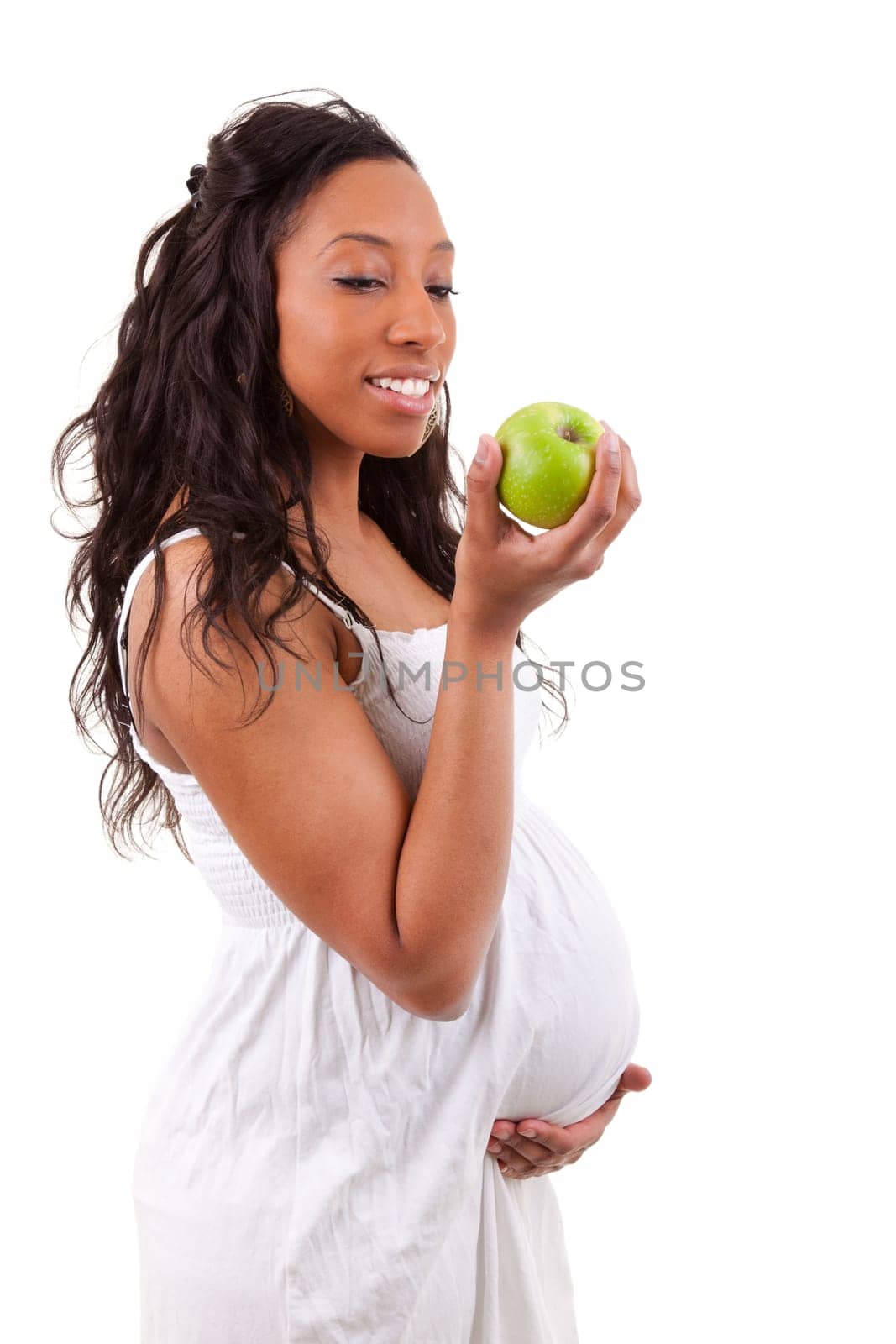 pregnant black woman eating an apple