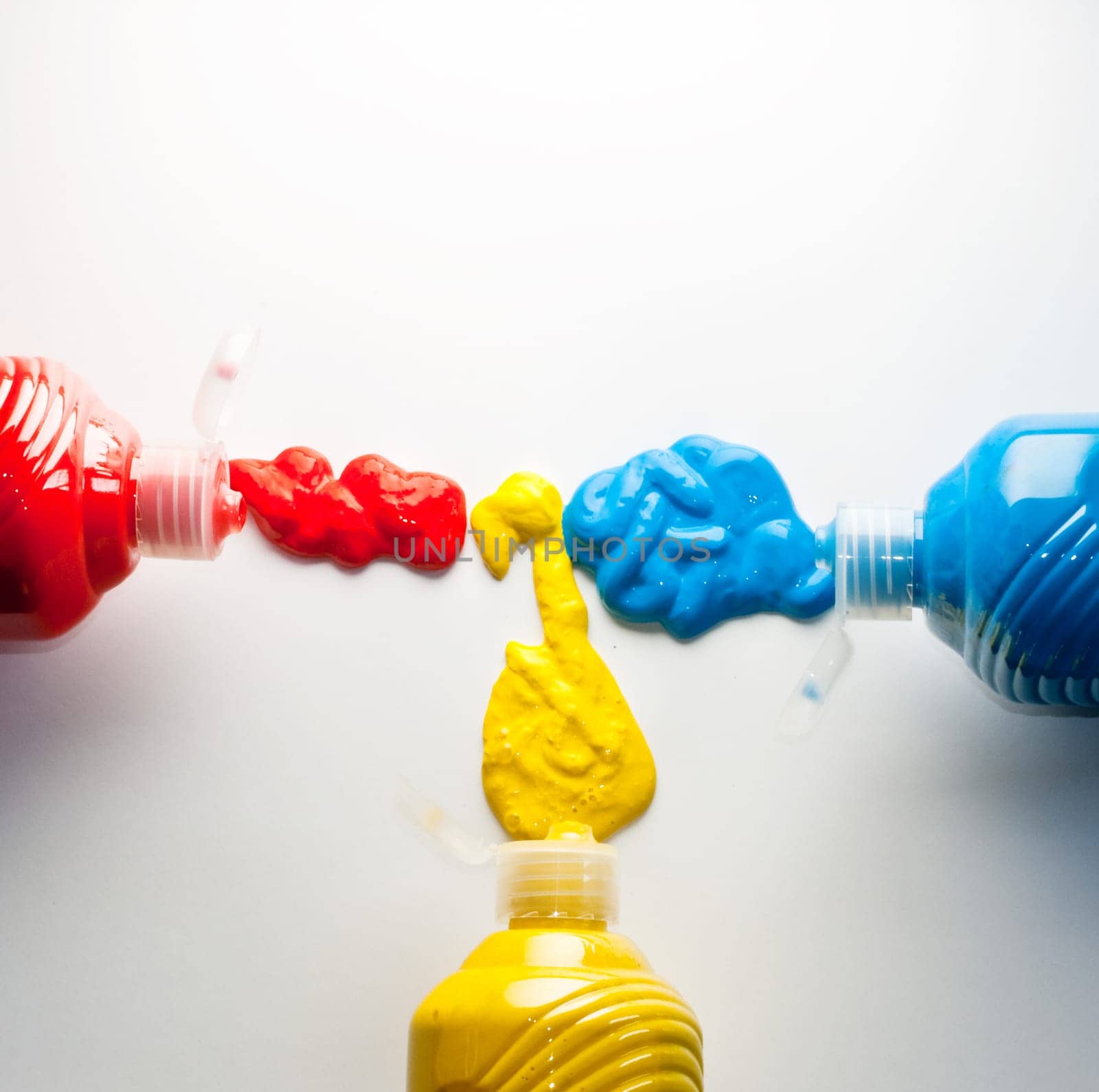 Paintbrushes with Blue, yellow and red Colors on white background