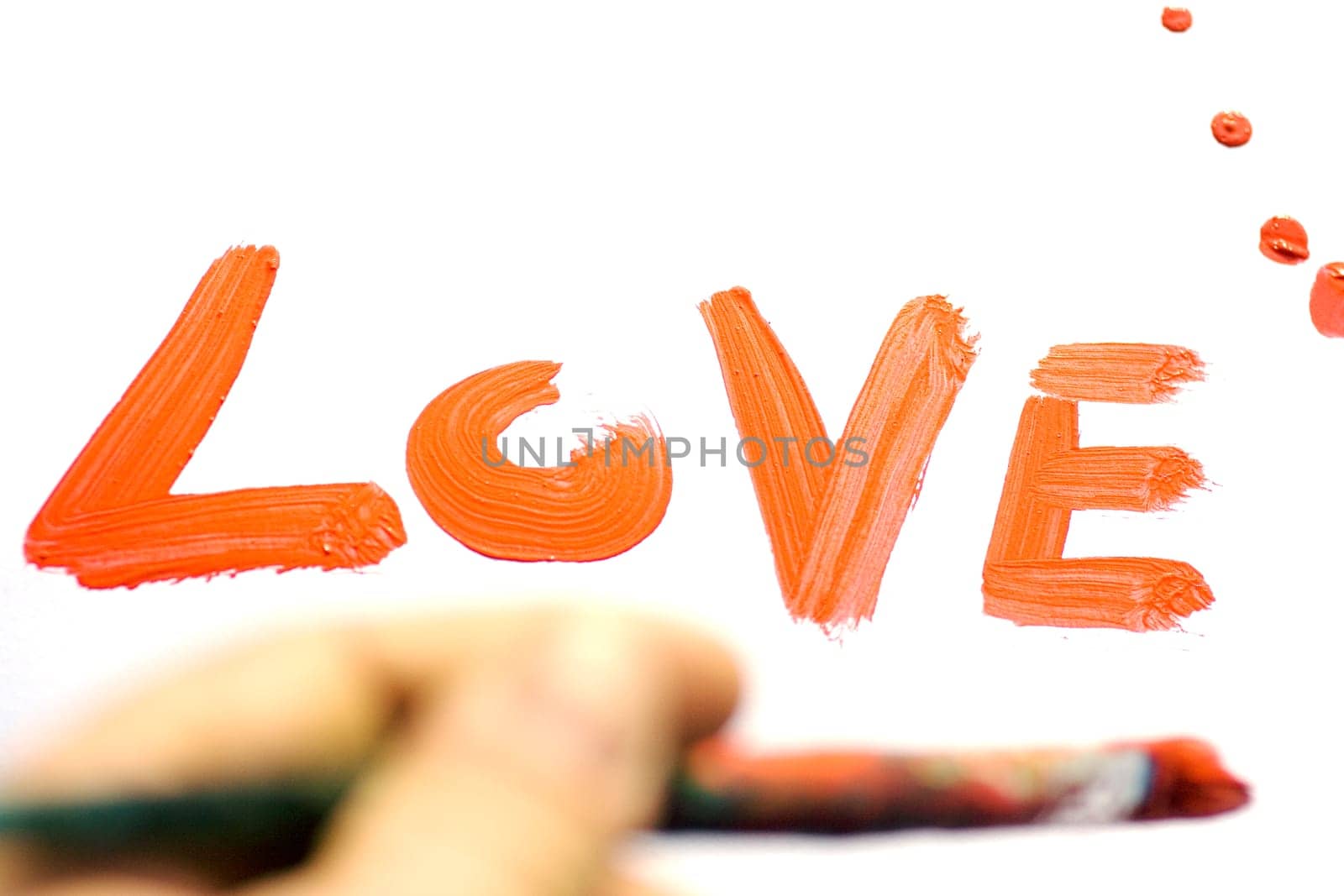 Love painted in red on white