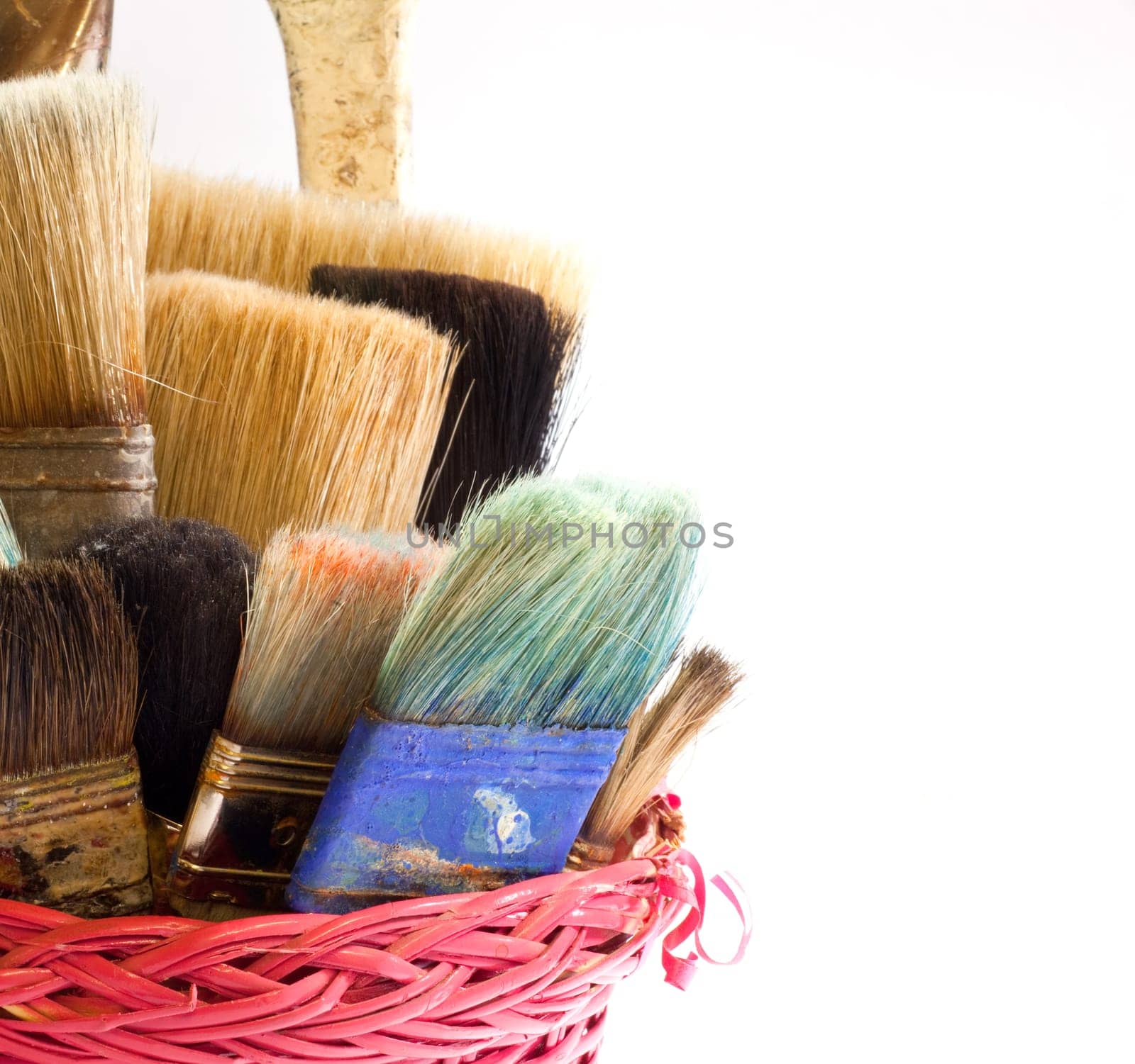 Paintbrushes inside a wicker basket