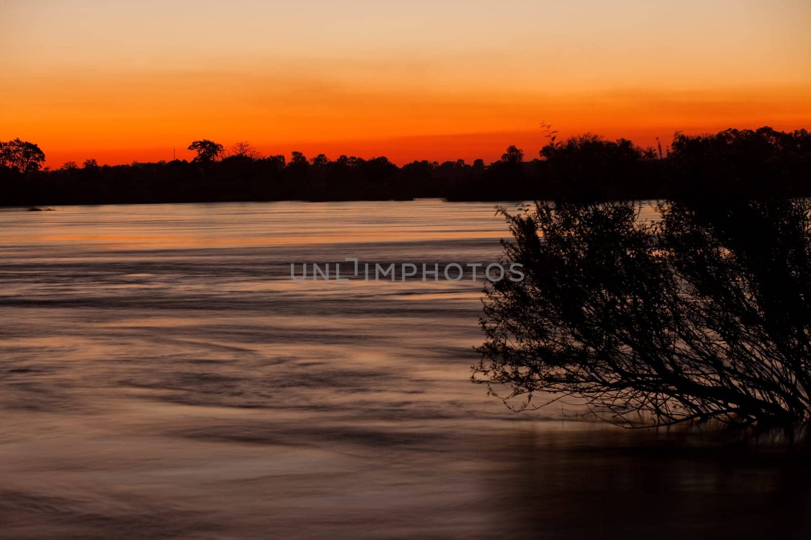 The Zambezi River at dusk, seen from Zambia