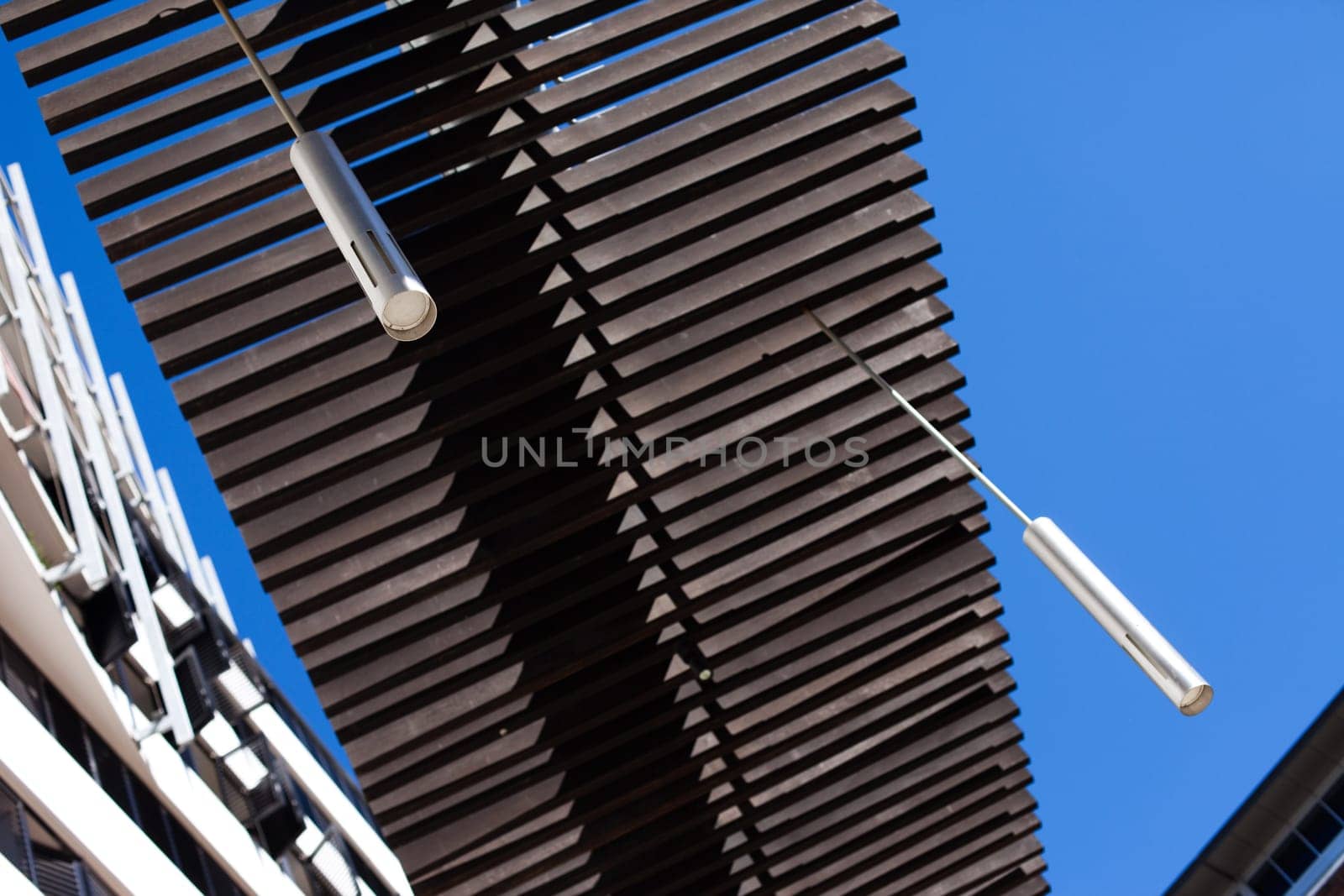 Modern lights and wood structure with blue sky