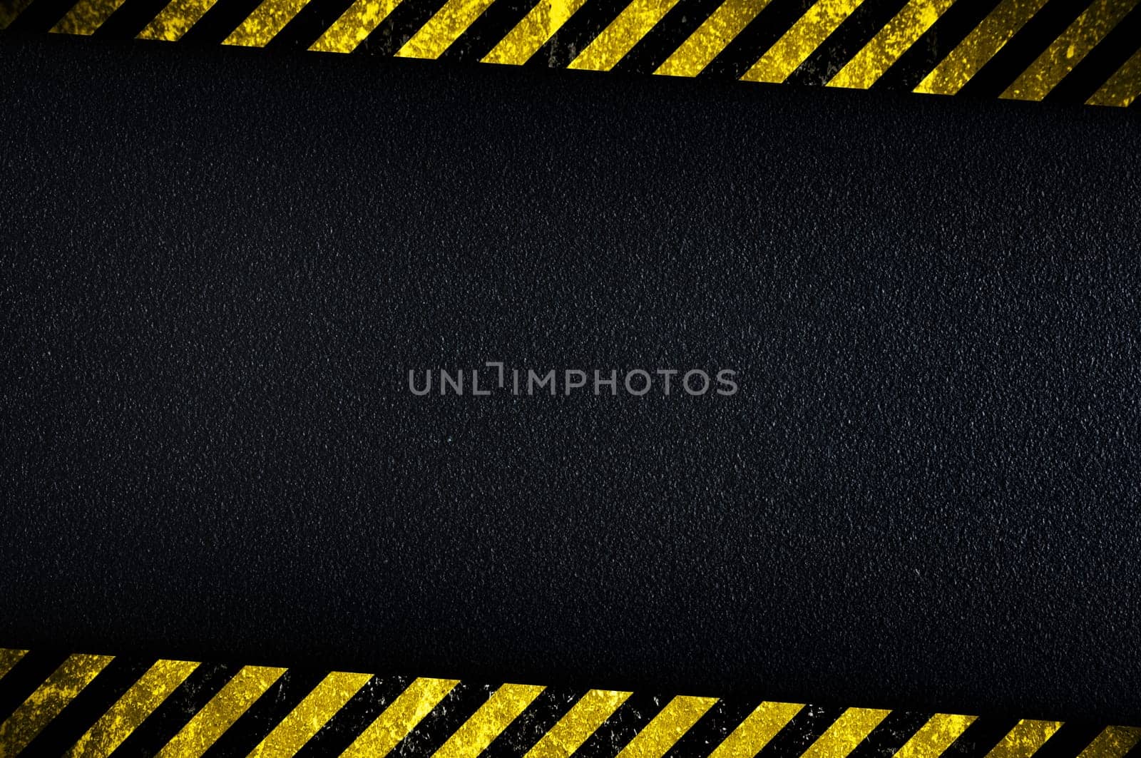 Grainy dark background with yellow caution stripes