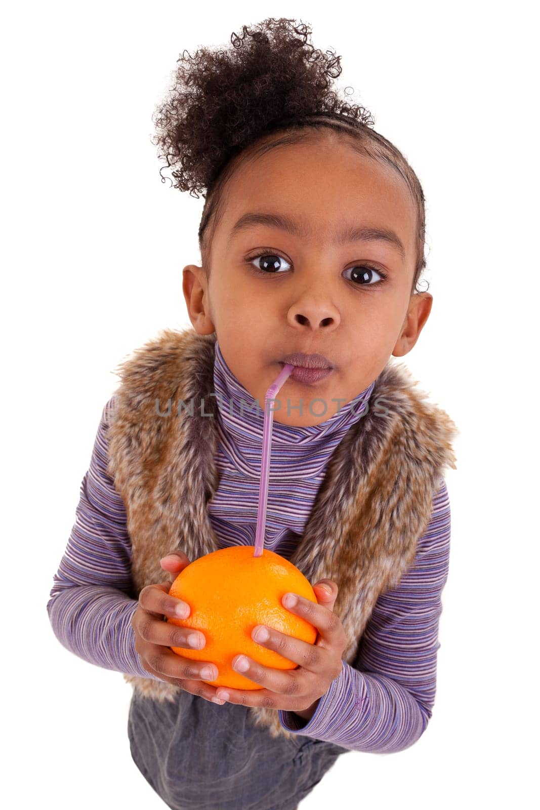 Little black girl drinking orange juice with a straw