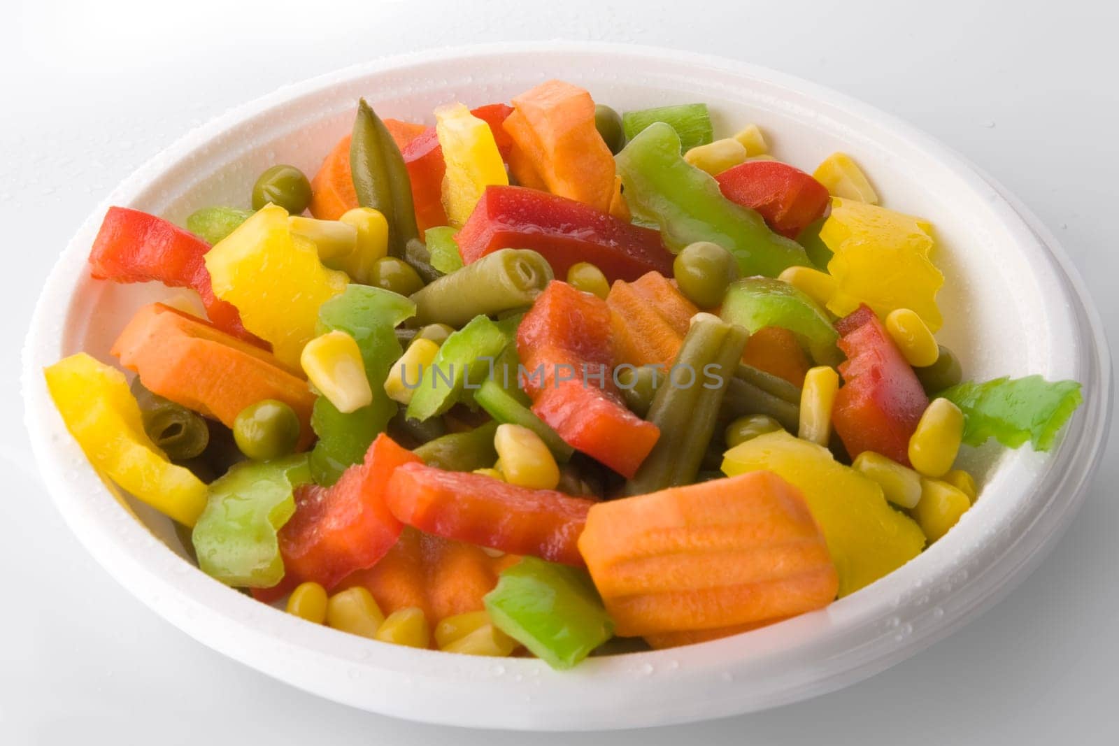 Fresh salad isolated on the white background. Mix.