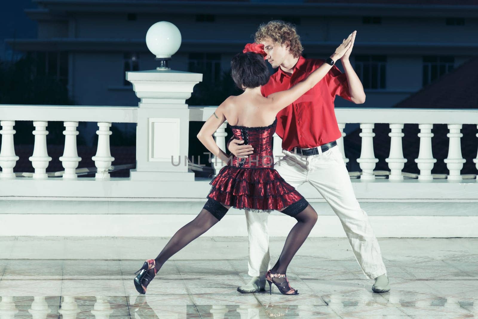 Couple dancing tango at the night time