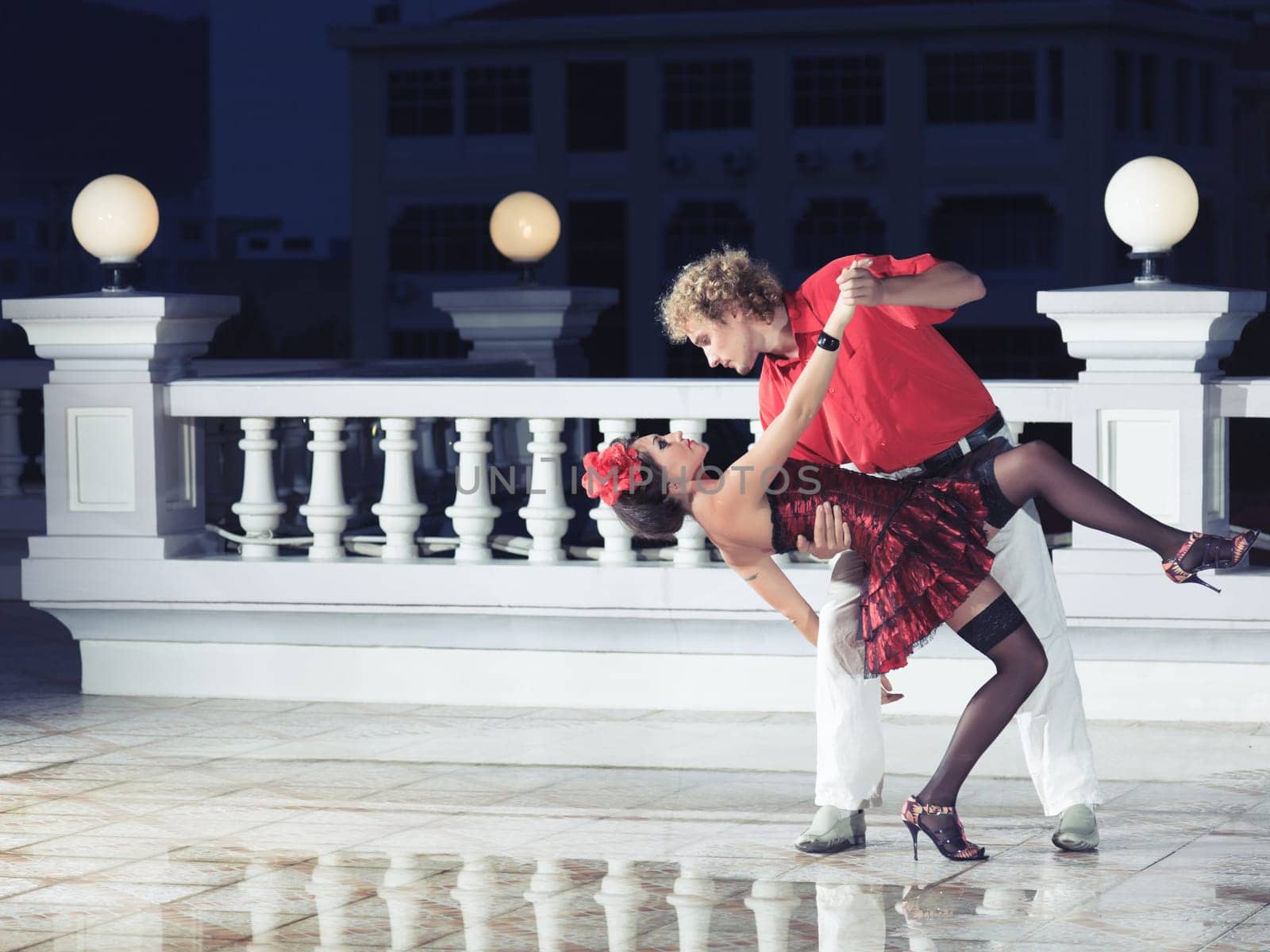 Couple dancing tango at the night time