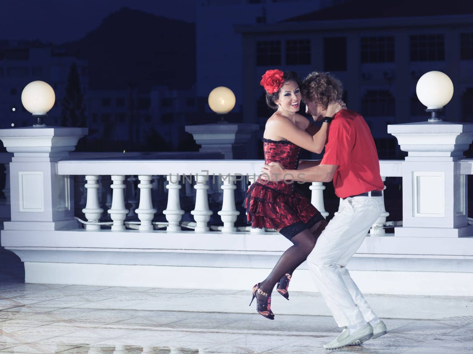 Couple dancing tango at the night time