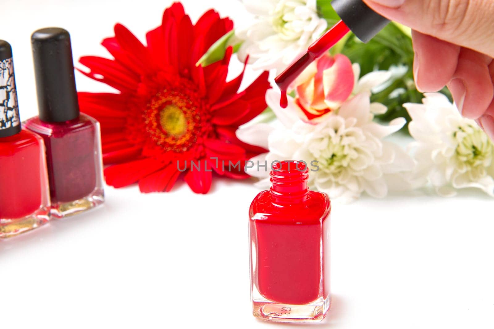 red nail polish with flower