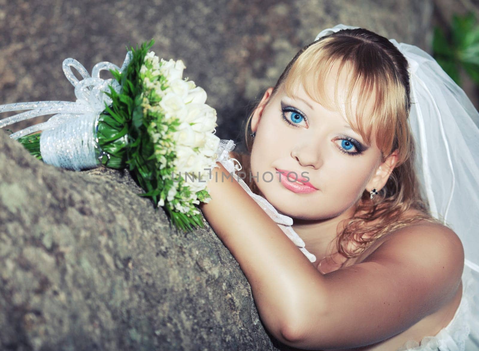Beautiful young bride in wedding dress outdoor