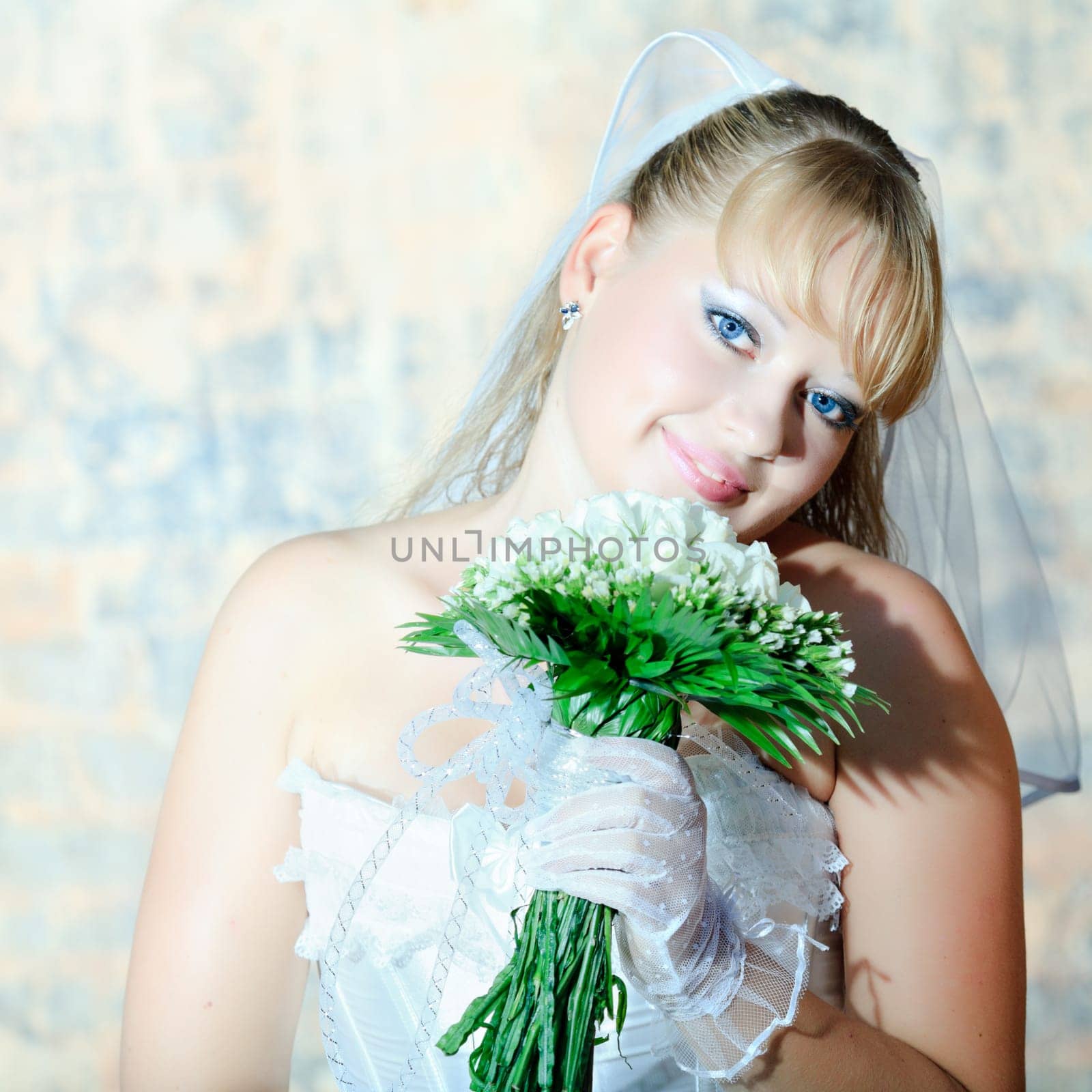 Beautiful young bride in wedding dress outdoor