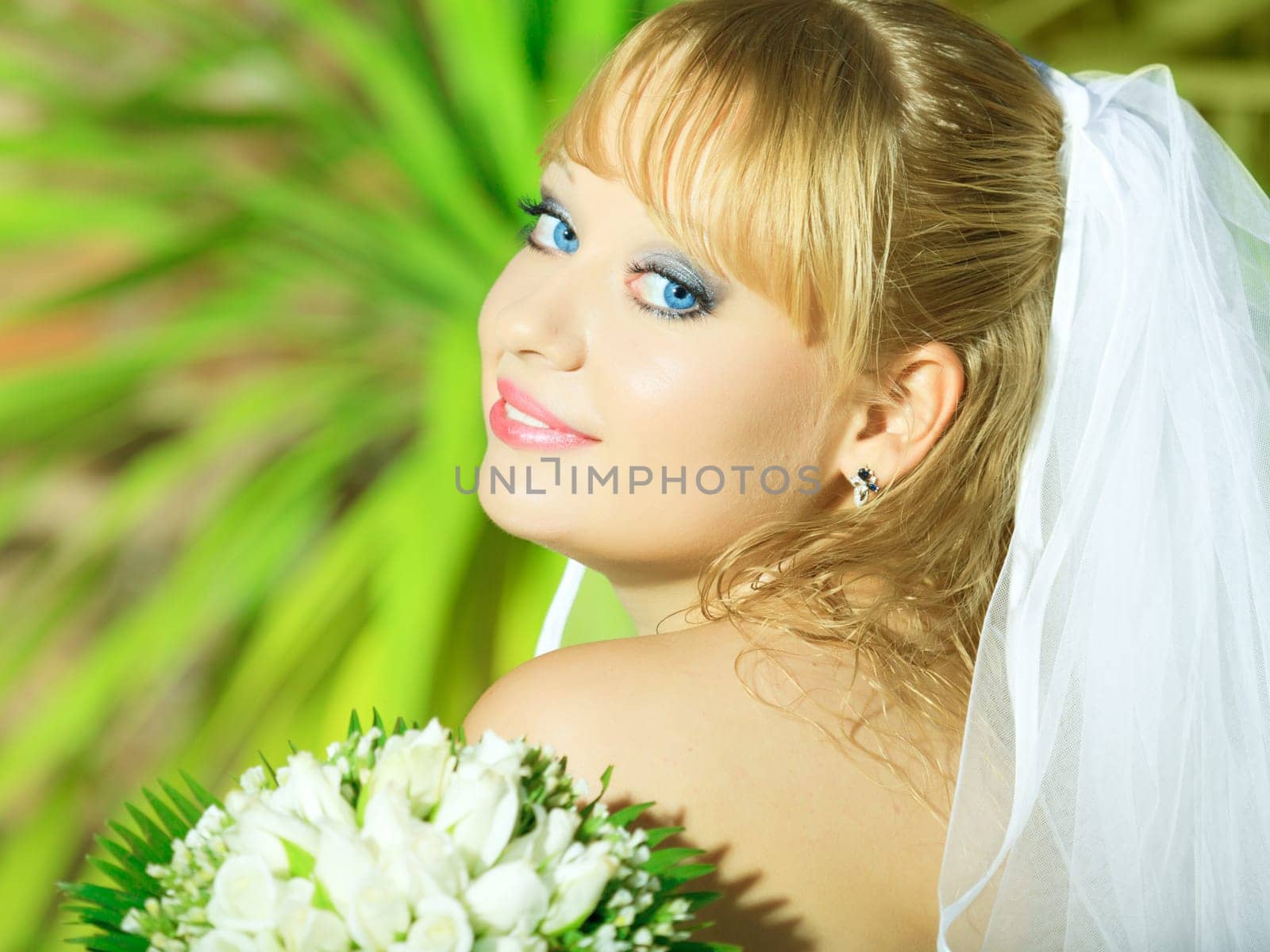 Beautiful young bride in wedding dress outdoor