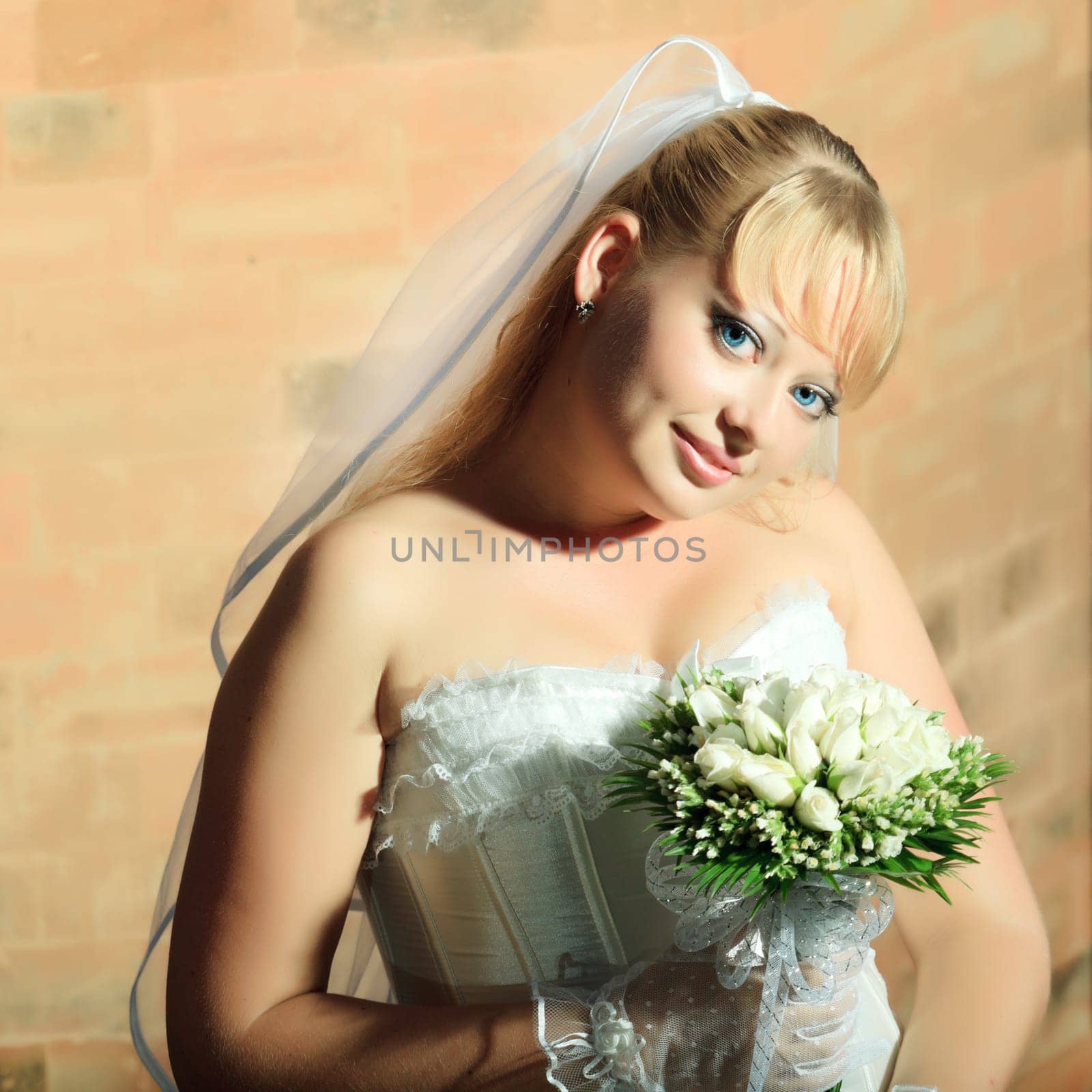 Beautiful young bride in wedding dress outdoor