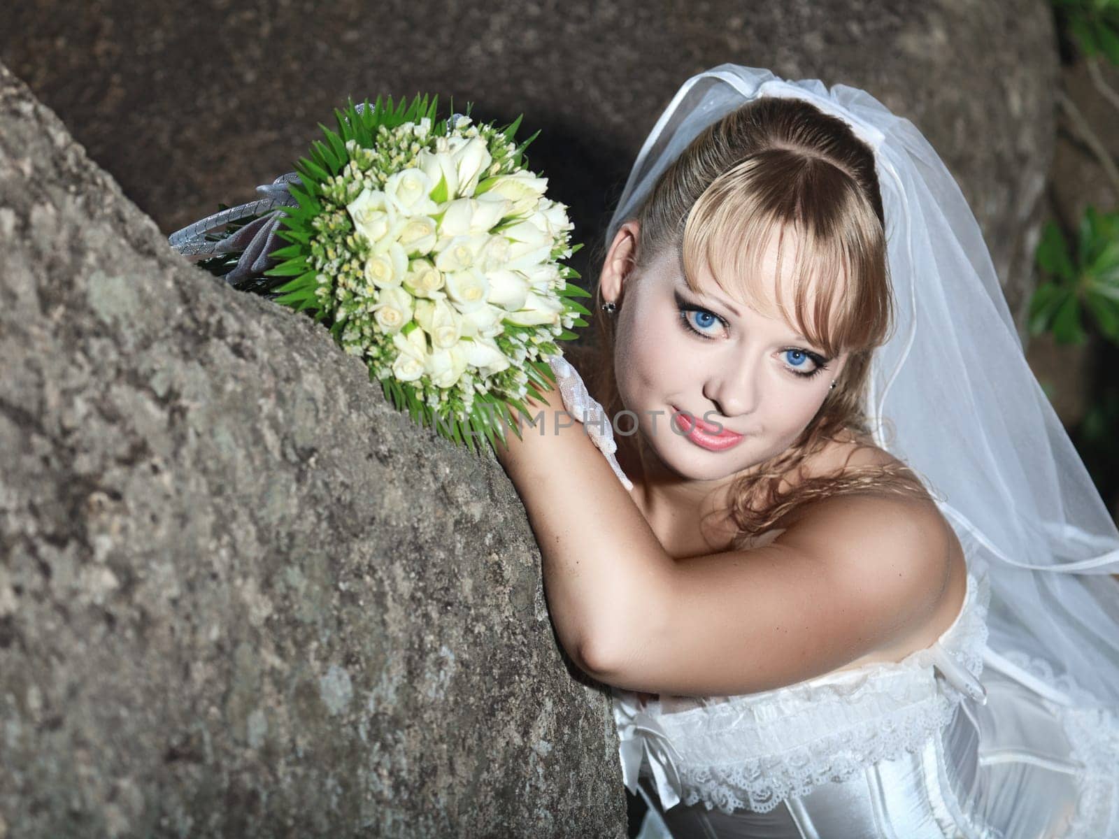 Beautiful young bride in wedding dress outdoor