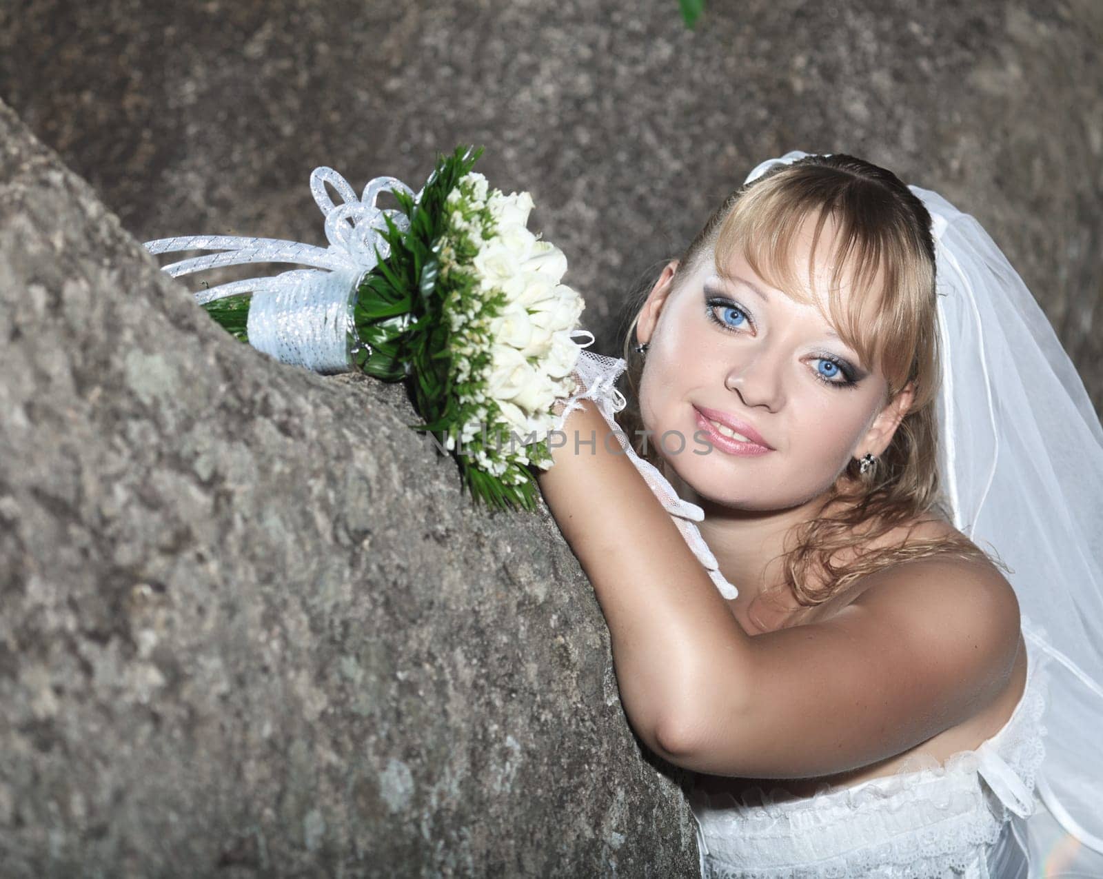 Beautiful young bride in wedding dress outdoor