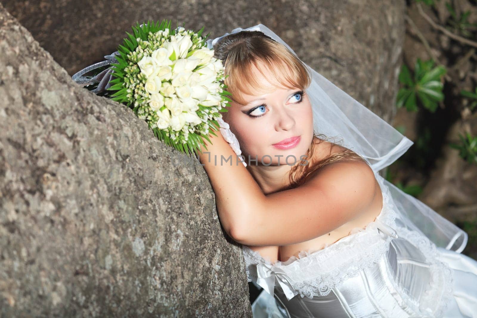 Beautiful young bride in wedding dress outdoor