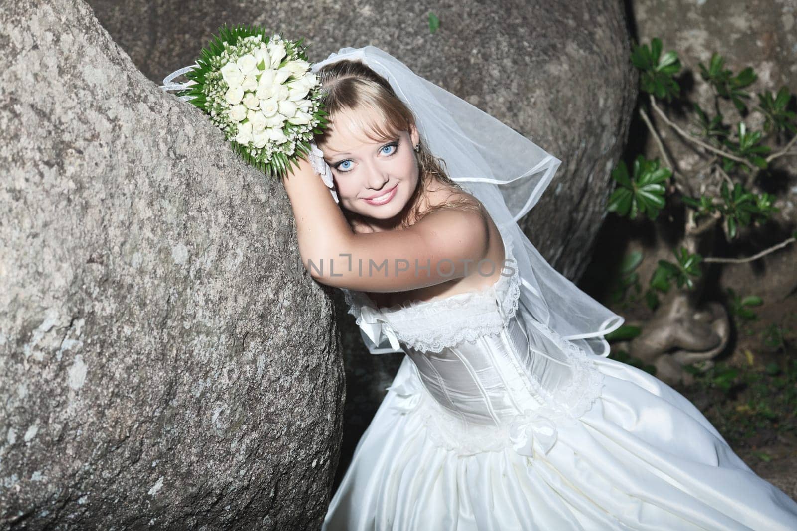 Beautiful young bride in wedding dress outdoor