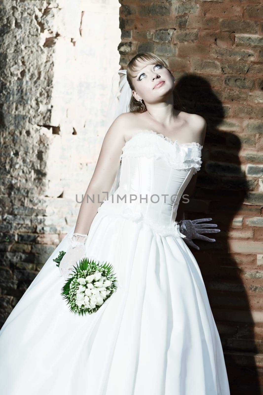 Beautiful young bride in wedding dress outdoor