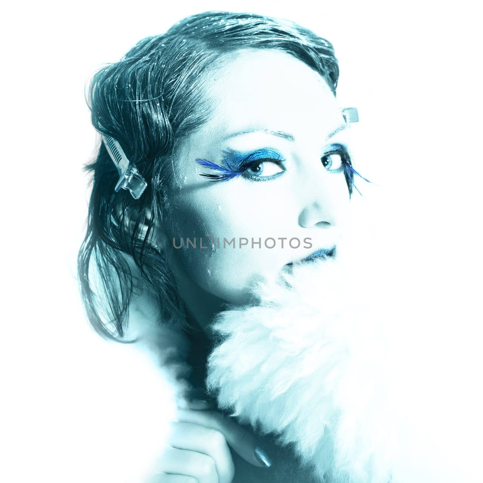 Woman as a snow queen in ice room