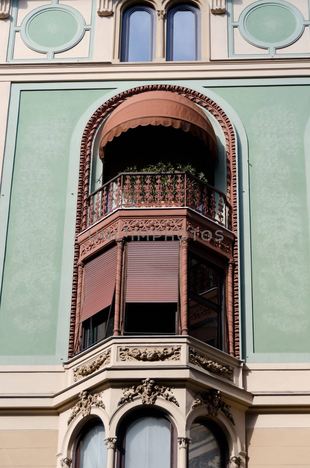 window with woodwork in the main street of Genoa