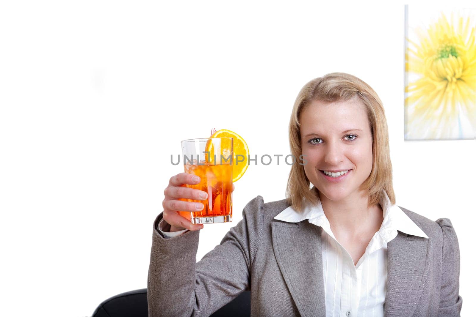 Young modern woman with a cocktail in her hand