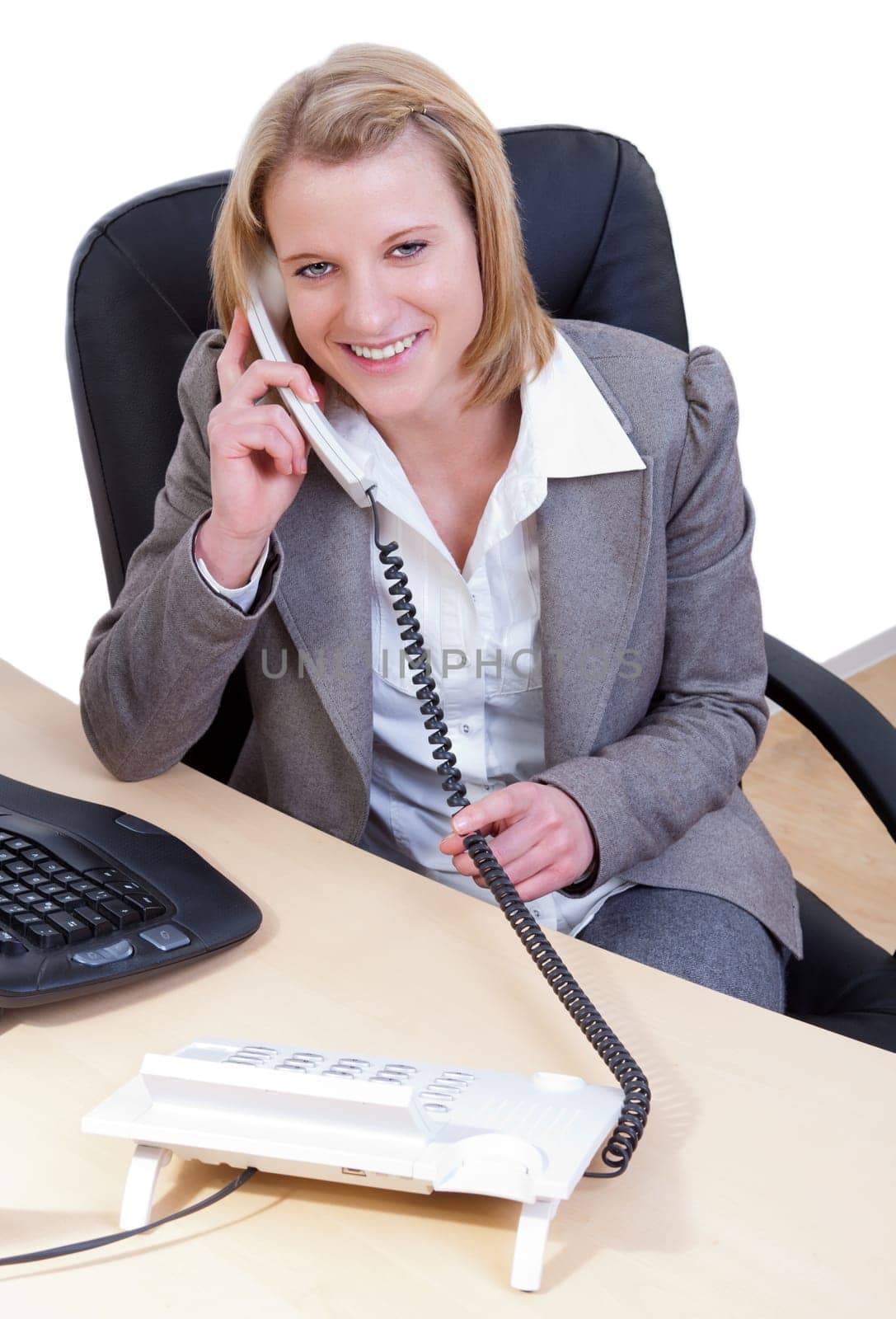 Young woman in office talking on the phone