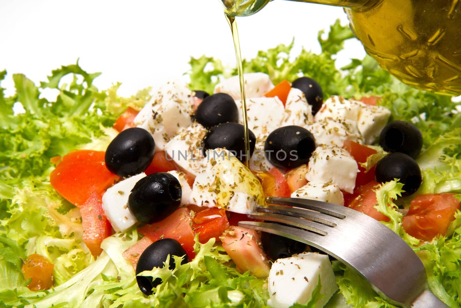 Fresh salad with olives, mozzarella cheese and  tomatoes
