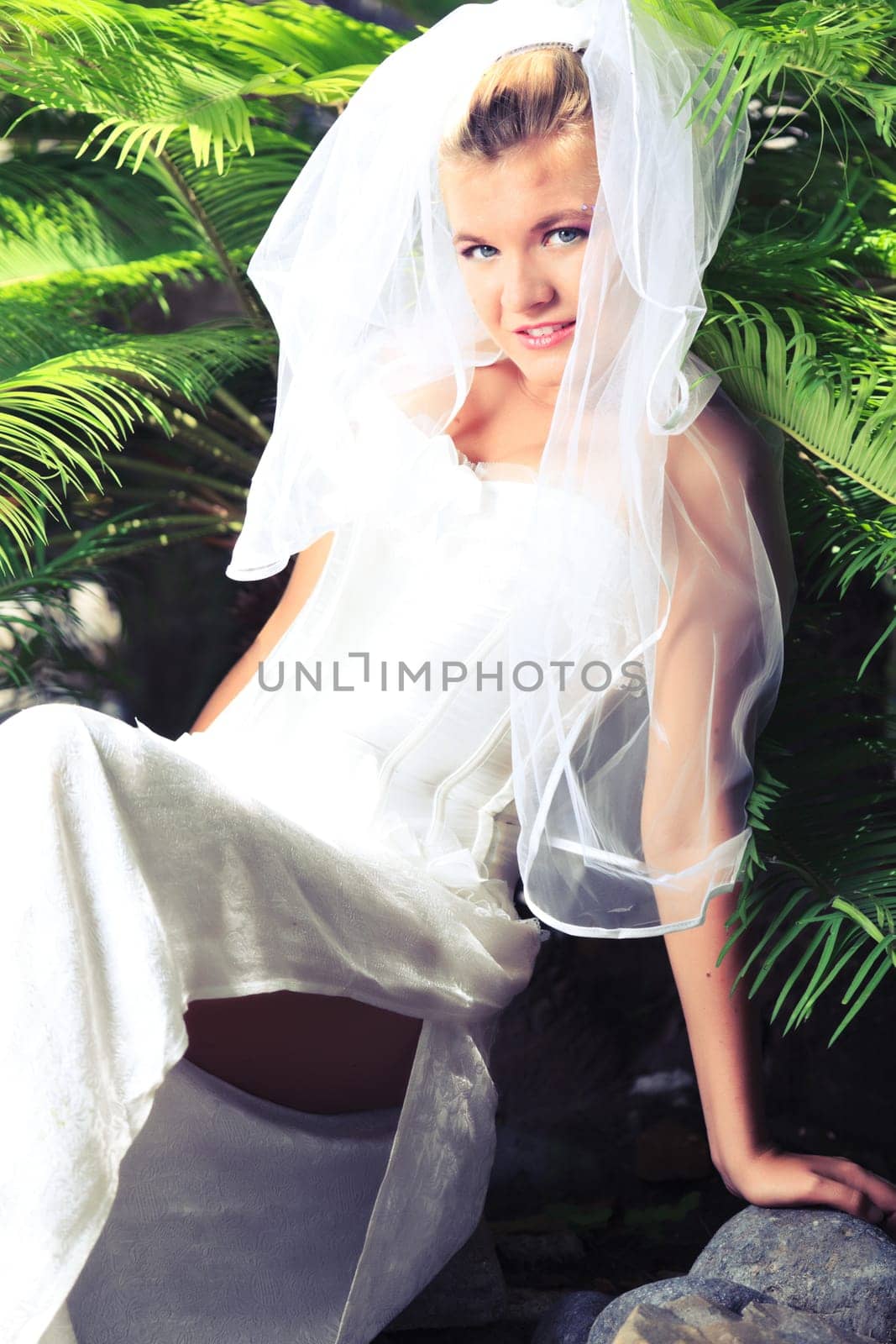 Beautiful young  bride on the tropical beach