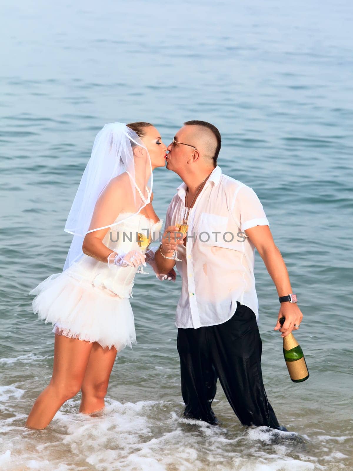 Wedding kiss on the tropical beach