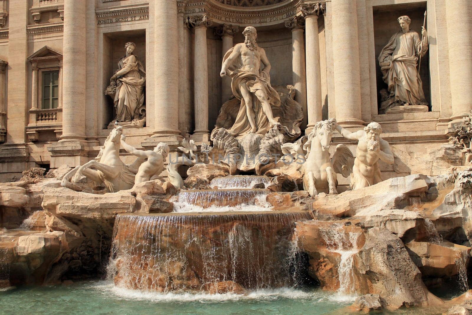 The beauty of the Trevi fountain lighted by the sun