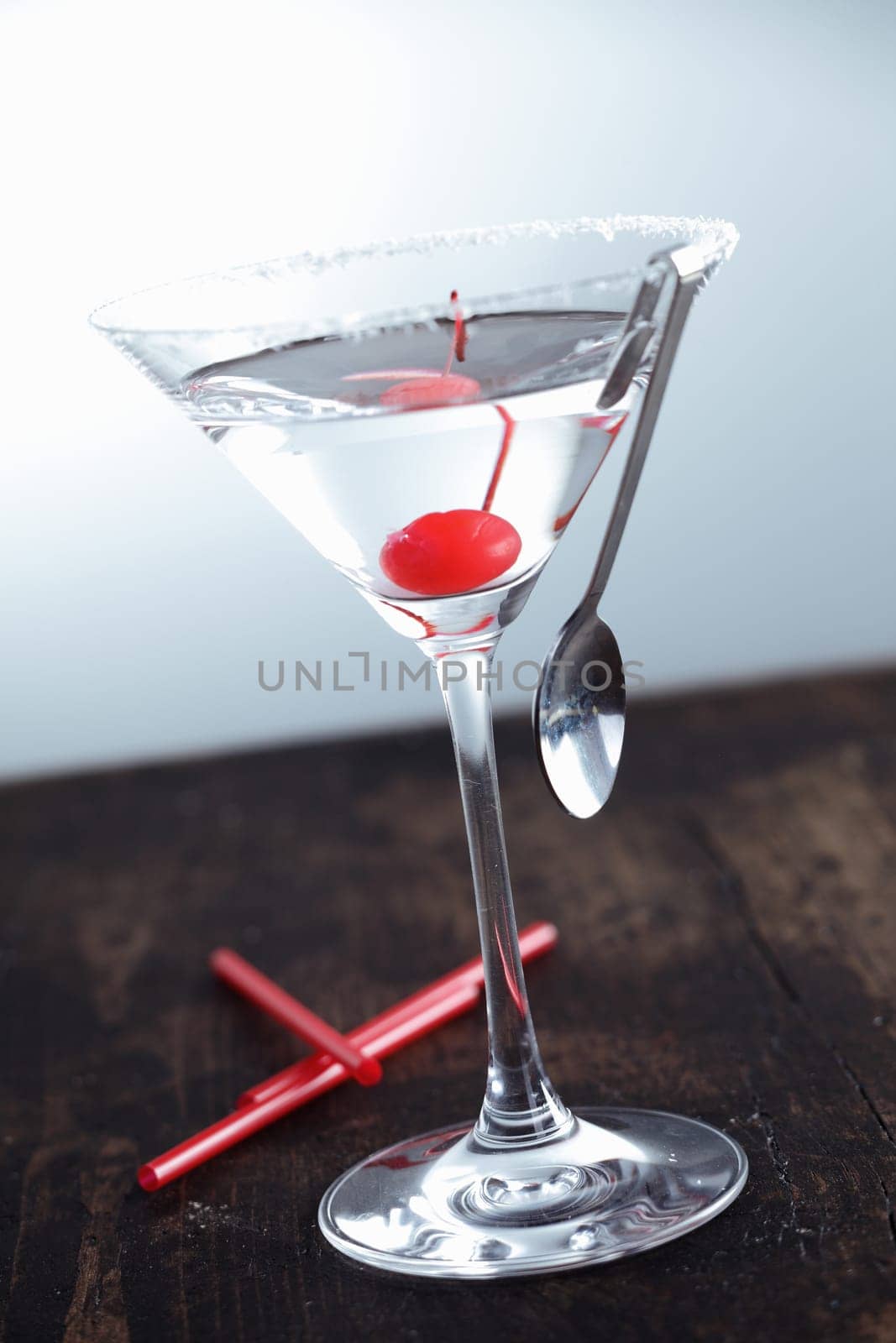 Dry Martini with a cherry on a aged background