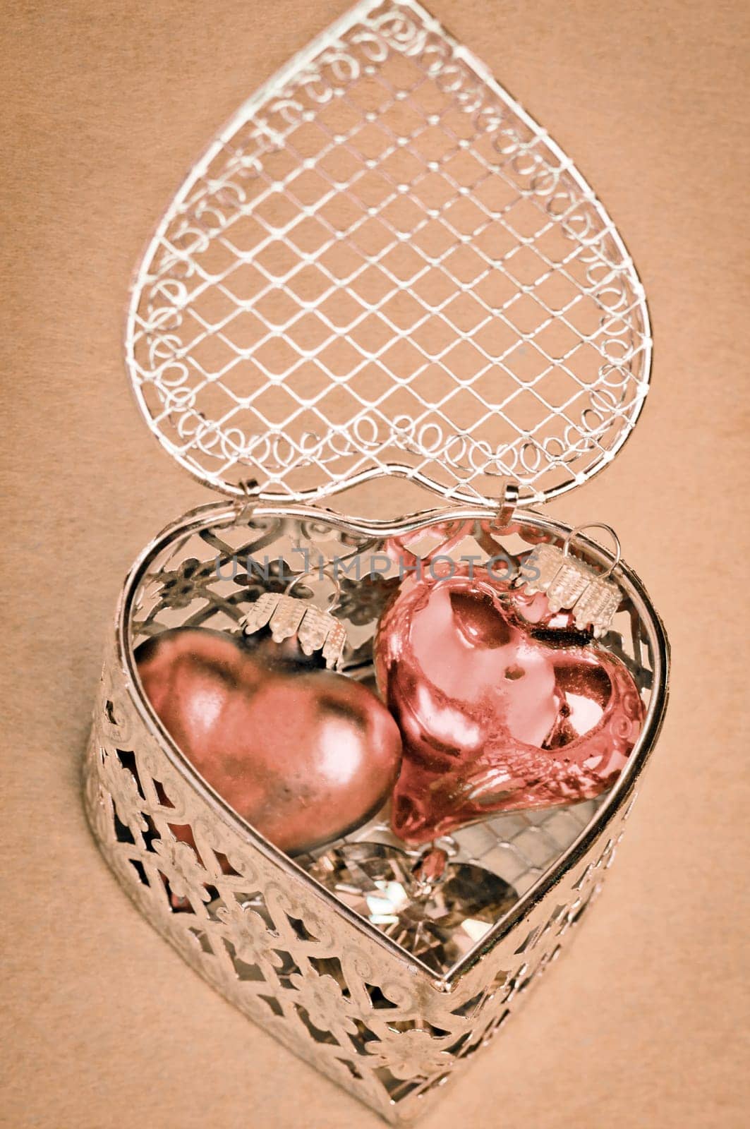 Valentines or anniversary gift of romantic hearts nestled inside a delicate silver filigree heart-shaped gift box