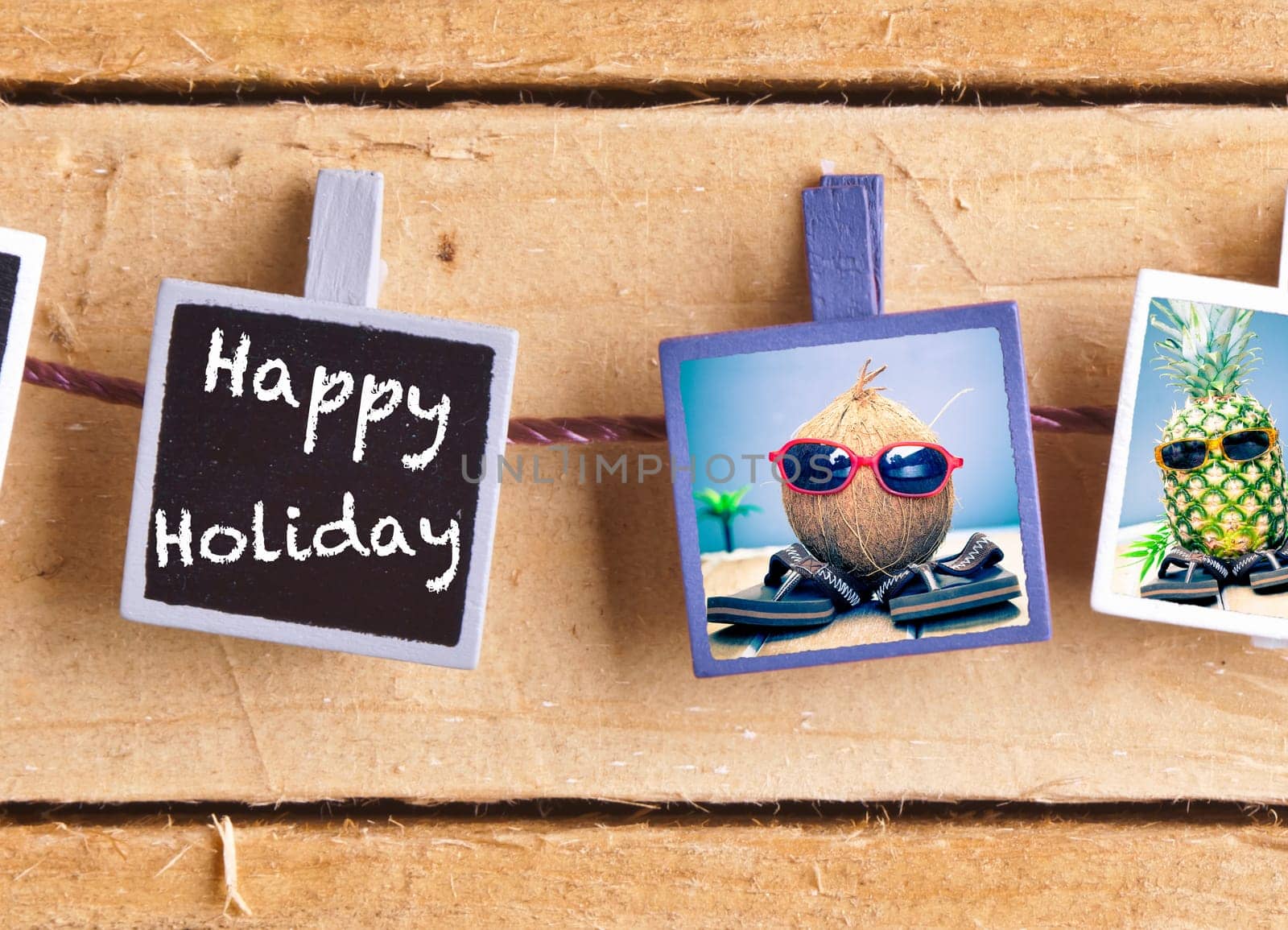 Happy Holiday snaps on a line of cool fruity friends, a coconut and pineapple, enjoying the tropics in their sunglasses and slip slops