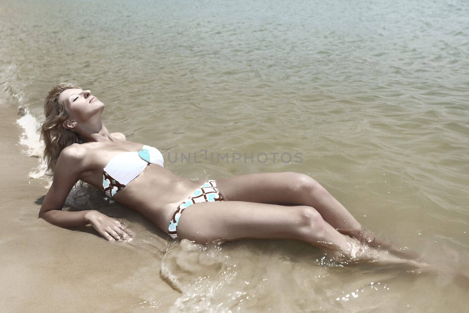 Beautiful woman in bikini on the beach
