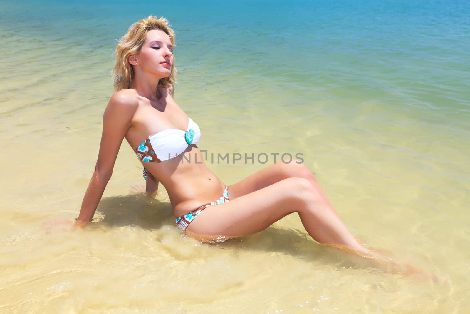 Beautiful woman in bikini on the beach