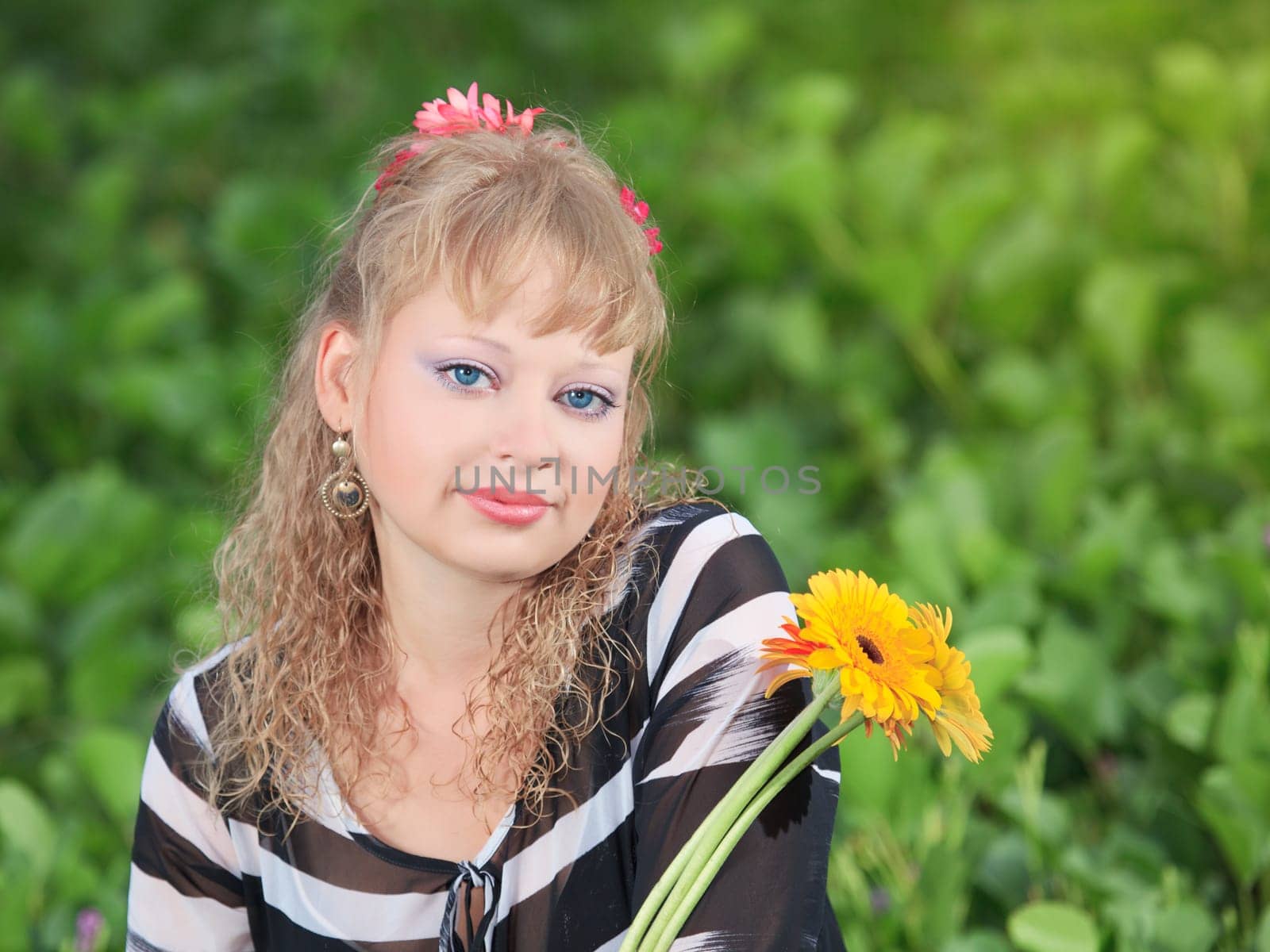 Beautiful young woman with flowers