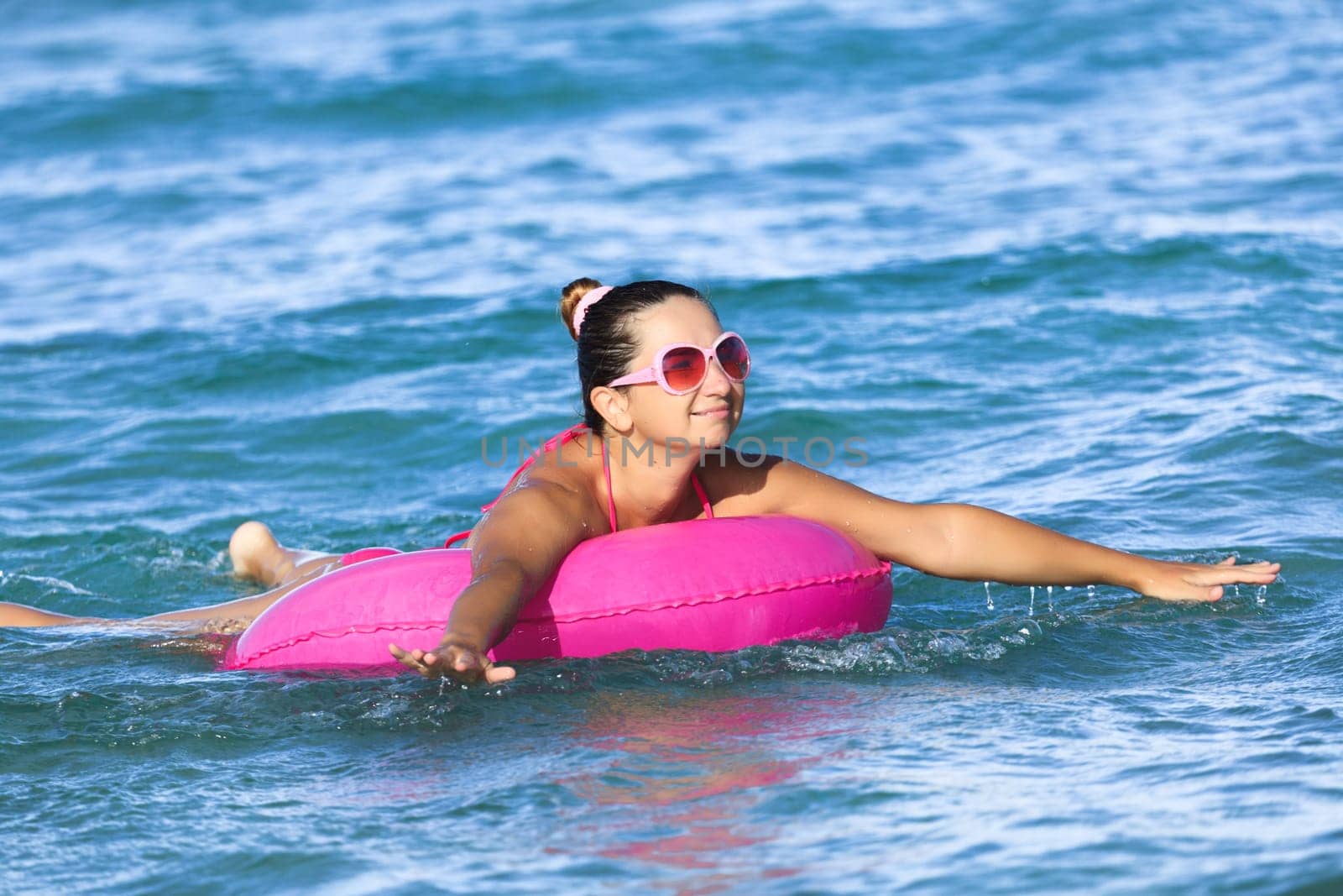Woman has a fun time on inner tube