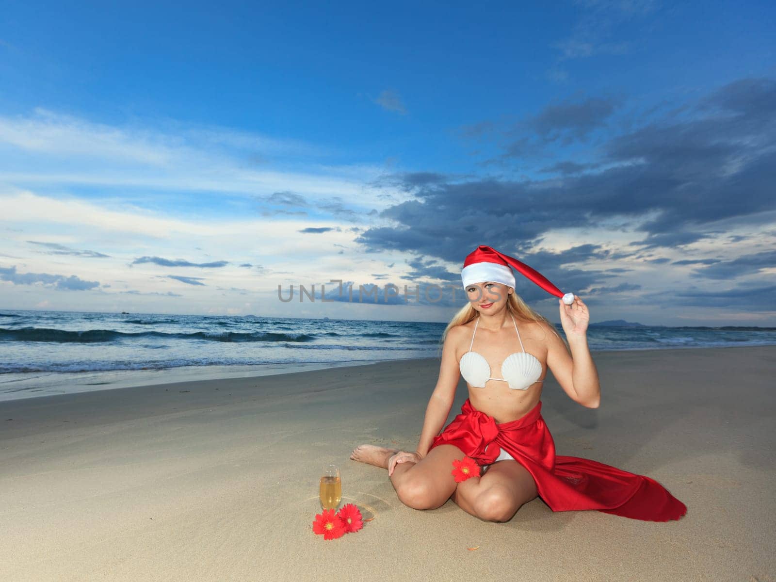 Miss Santa celebrates Christmas at the tropical beach