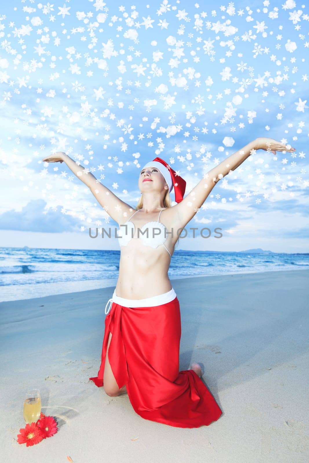 Miss Santa celebrates Christmas at the tropical beach
