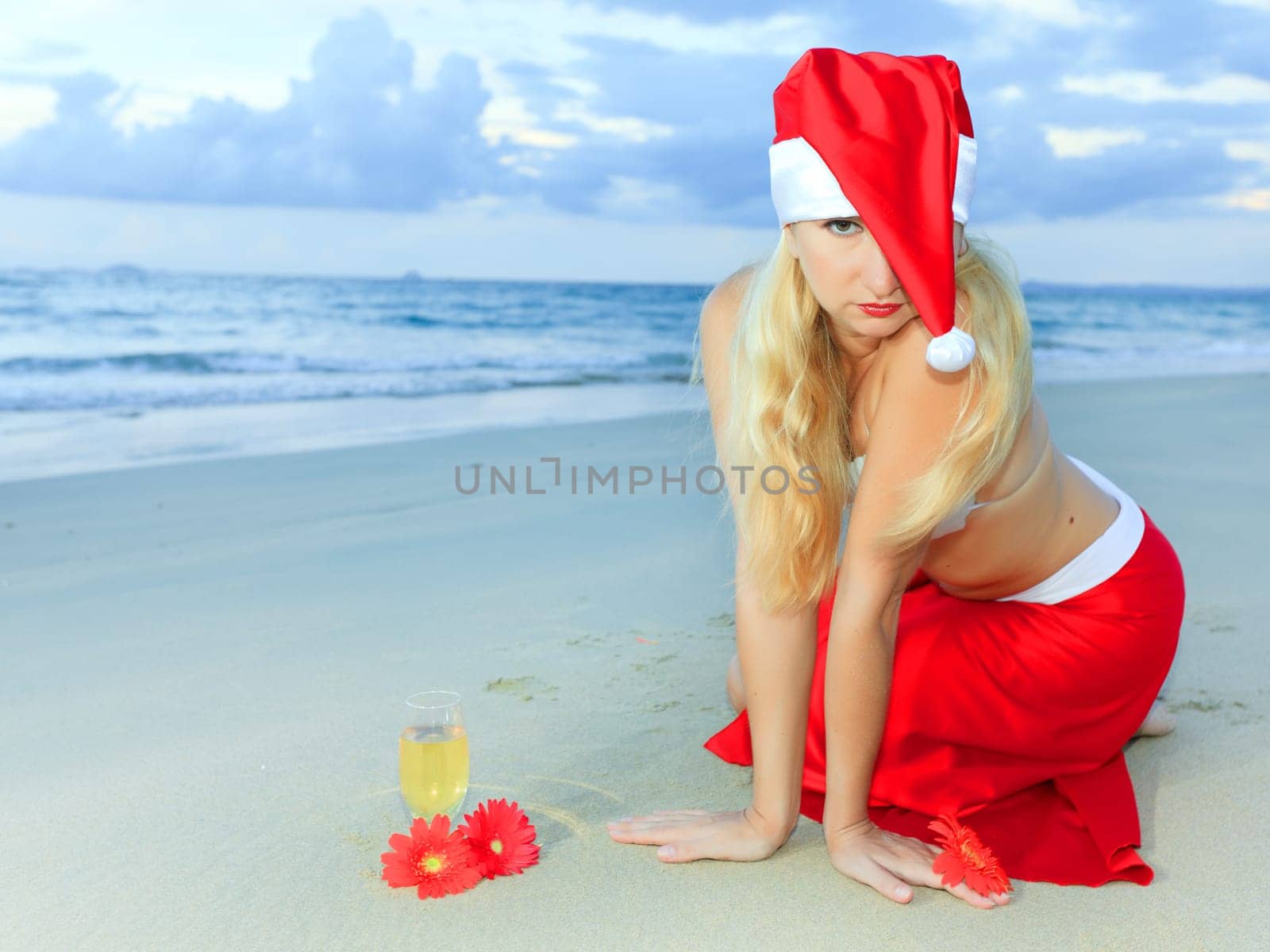 Miss Santa celebrates Christmas at the tropical beach
