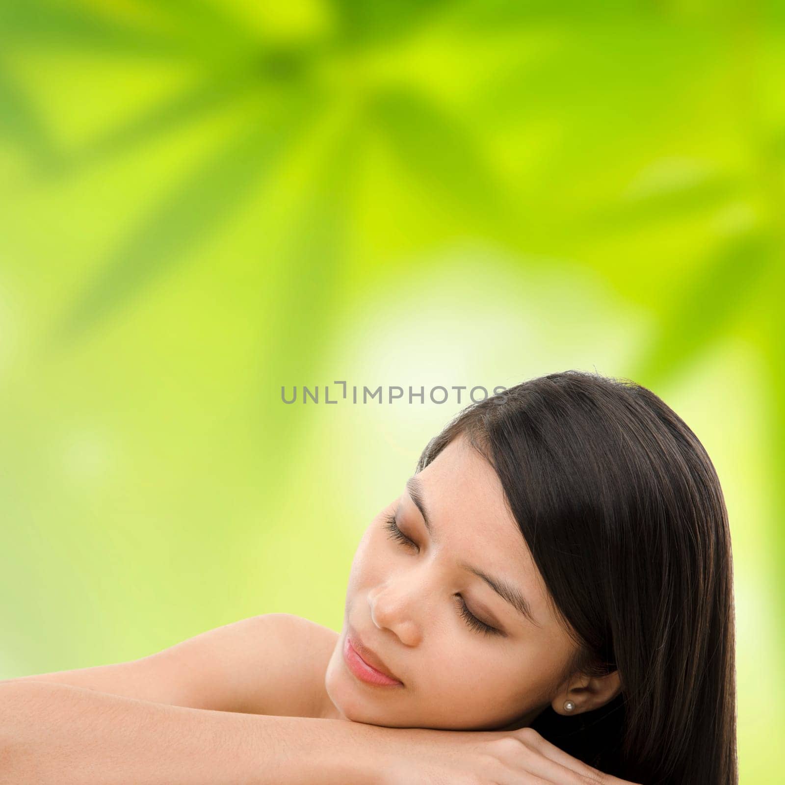Beautiful Asian Girl having a relaxing time in beauty spa